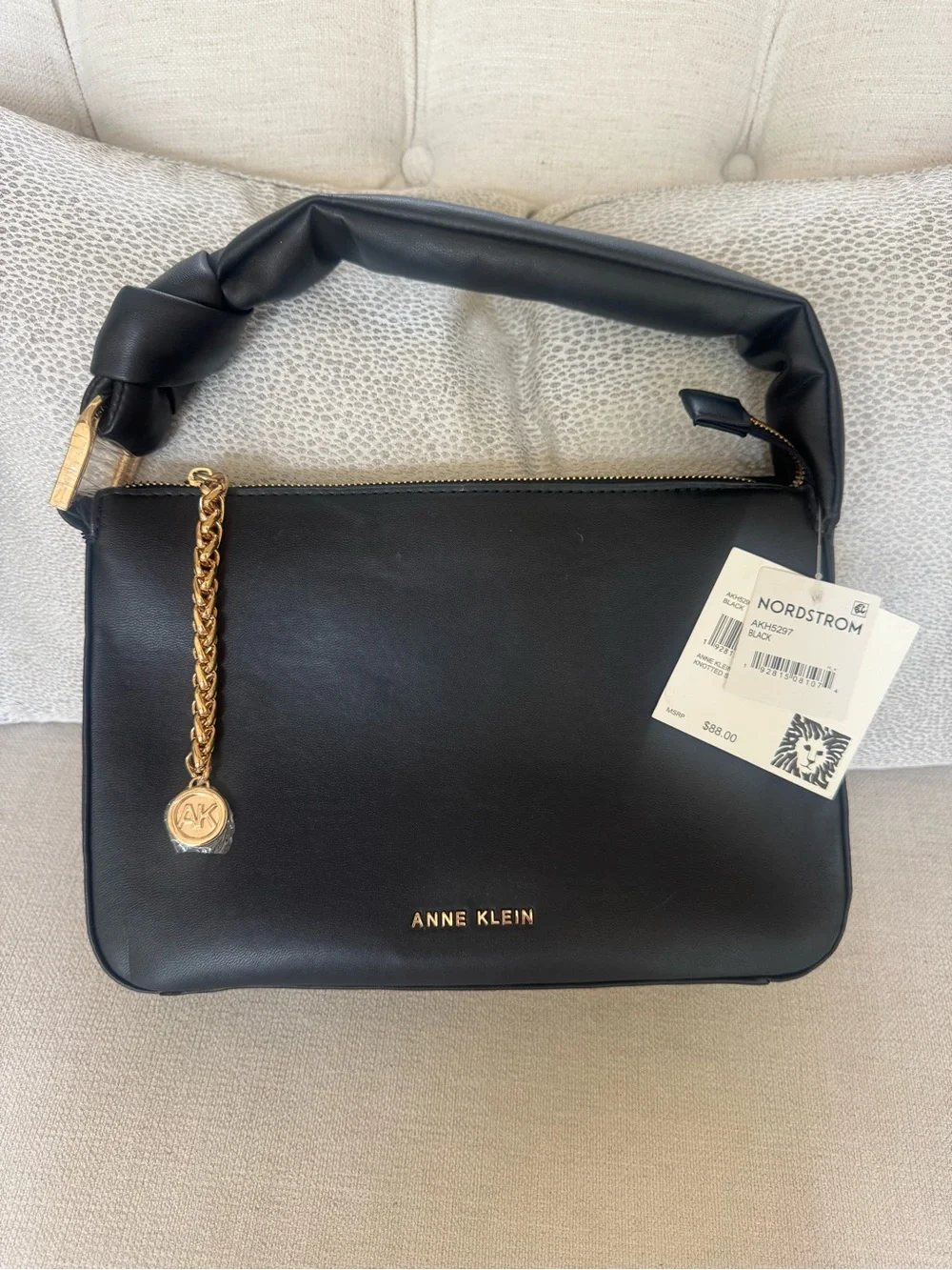Anne Klein knotted satchel. Black Leather Top-Handle Bag with Gold Chain Accent
